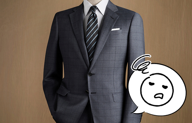 グレーのチェックのスーツに、ストライプのネクタイを締めた男性