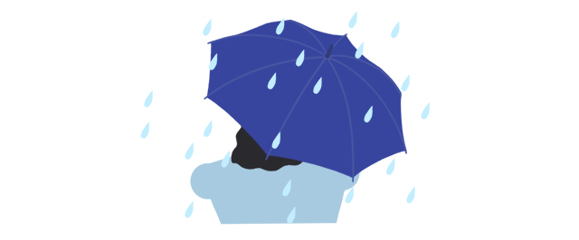 雨の中で傘をさしている人