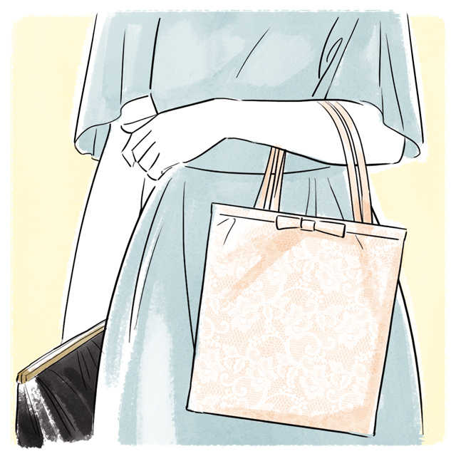 紙バッグを持った女性の手元
