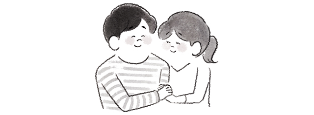 ほほえむ男女