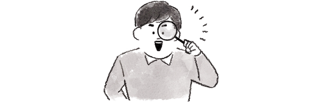 虫眼鏡を覗く男性