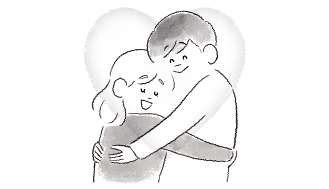 抱きしめ合うカップル