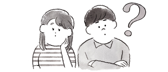 首をかしげる男女
