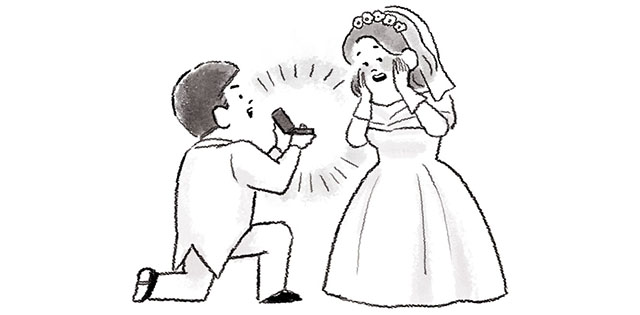 結婚式で新婦に婚約指輪を渡す新郎