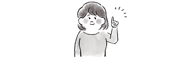人差し指を立てる女性