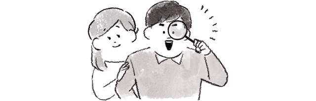 虫眼鏡を覗く男女