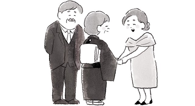 新郎新婦の親からお礼を渡されている人