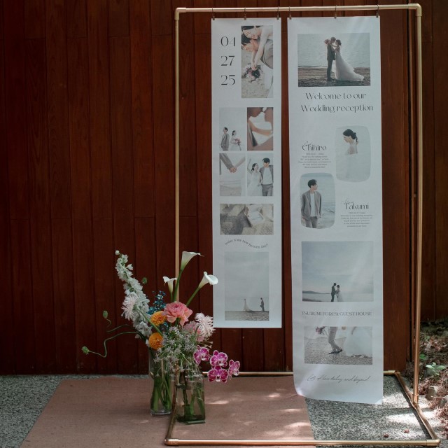前撮り写真をタペストリーにして吊るしたウェルカムボード