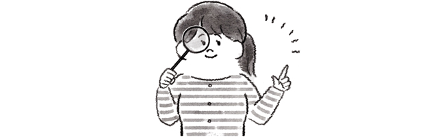 虫眼鏡を見る女性