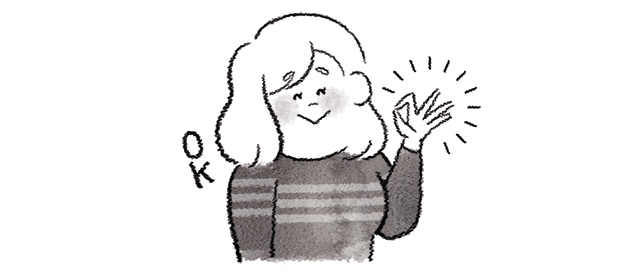 OKマークを指で作る女性