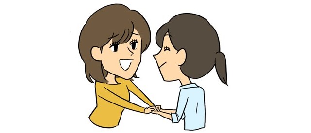 友達の手を握る人