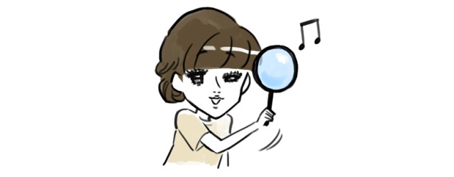 虫眼鏡を覗く女性