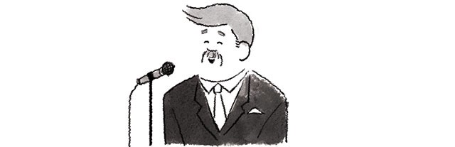 目線を上げて話す男性