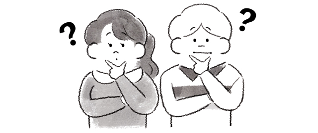 首をかしげる男女