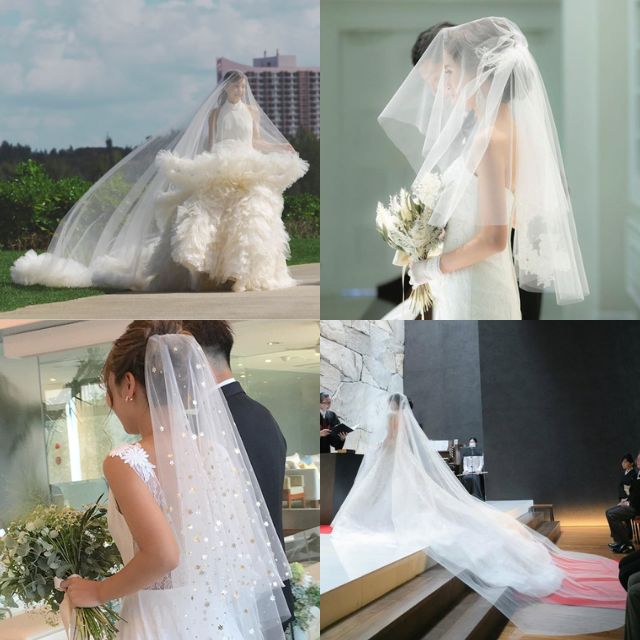 ベールをつけたウェディングドレス姿の女性