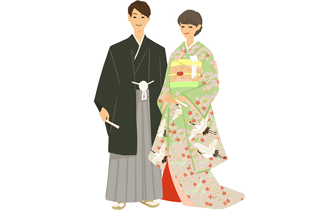 紋付袴を着た新郎と色打掛を着た新婦が並んで立つ様子