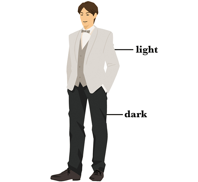 明るめのジャケットと暗めのパンツを着た男性